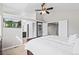 This main bedroom offers an ensuite bath, vaulted ceilings, a ceiling fan and large windows at 9432 La Quinta Way, Lone Tree, CO 80124
