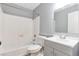 Clean bathroom featuring a shower-tub combo, toilet, and vanity with modern fixtures at 10722 E Exposition Ave # 314, Aurora, CO 80012