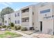 Two story apartment exterior with well-maintained landscaping at 10722 E Exposition Ave # 314, Aurora, CO 80012
