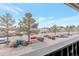 Parking lot with various cars and visible scenery at 10722 E Exposition Ave # 314, Aurora, CO 80012