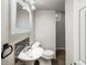 Small bathroom featuring a modern sink with mosaic tile and updated fixtures at 945 Emerald St, Broomfield, CO 80020