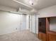Carpeted bedroom with white trim offers a closet and an open floor plan for flexible living at 945 Emerald St, Broomfield, CO 80020