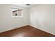 Bedroom with hardwood floors and window providing natural light at 945 Emerald St, Broomfield, CO 80020