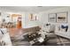 Open-concept living room featuring hardwood floors, natural light, and stylish decor at 945 Emerald St, Broomfield, CO 80020