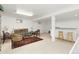 Finished basement recreation room with wet bar and seating area at 11368 Lamar St, Westminster, CO 80020