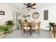 Charming dining area with a wooden table and sliding door access at 11368 Lamar St, Westminster, CO 80020