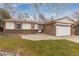 Brick ranch home with a paved patio and attached garage at 11368 Lamar St, Westminster, CO 80020