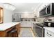 Modern kitchen with stainless steel appliances and an island at 11368 Lamar St, Westminster, CO 80020