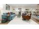 Spacious living area featuring a teal sofa and armchairs at 11368 Lamar St, Westminster, CO 80020