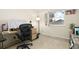 Home office with a large desk and comfortable chair at 11368 Lamar St, Westminster, CO 80020