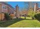 Spacious backyard with lush green grass, mature trees, and privacy fencing, perfect for outdoor enjoyment at 13462 E Asbury Dr, Aurora, CO 80014