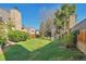 Lush backyard with green lawn and privacy features; a serene outdoor space for relaxing and activities at 13462 E Asbury Dr, Aurora, CO 80014