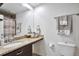 Bathroom with a single sink vanity and granite countertop, and adjacent toilet at 13462 E Asbury Dr, Aurora, CO 80014