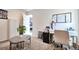 Cozy bedroom featuring a work space with desk, chair, and ring light at 13462 E Asbury Dr, Aurora, CO 80014