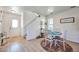 Bright dining area with natural light, hardwood floors, and stylish décor, perfect for Gathering meals at 13462 E Asbury Dr, Aurora, CO 80014