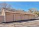 Row of neutral-colored garages under a blue sky, promising convenient parking and storage solutions at 13462 E Asbury Dr, Aurora, CO 80014