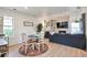 Open floor plan with a comfortable living room, dining space, and hardwood floors, great for entertaining at 13462 E Asbury Dr, Aurora, CO 80014