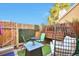 Cozy patio with comfortable seating, privacy fence, and charming outdoor decor for relaxing and entertaining at 13462 E Asbury Dr, Aurora, CO 80014