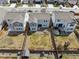 Aerial view showing backyards with fencing, play equipment, and potential garden spaces, capturing outdoor living at 27837 E 8Th Ave, Aurora, CO 80018
