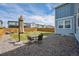 Spacious backyard with a dining set, an umbrella and low-maintenance rock landscaping at 27837 E 8Th Ave, Aurora, CO 80018