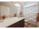 Bathroom with a large mirror, double lights, a toilet and walk-in shower at 27837 E 8Th Ave, Aurora, CO 80018