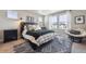 Bedroom with bed, decor, and two windows that bring natural lighting into the home at 27837 E 8Th Ave, Aurora, CO 80018