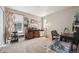 Bedroom with carpet, decor, and two windows allowing for natural lighting at 27837 E 8Th Ave, Aurora, CO 80018