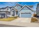 Inviting curb appeal of this two-story home with a two-car garage and driveway at 27837 E 8Th Ave, Aurora, CO 80018
