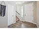 Inviting foyer featuring stylish wood flooring, a coat closet, and stairs to the upper level at 27837 E 8Th Ave, Aurora, CO 80018