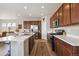 Modern kitchen with stainless steel appliances, a large island, and ample cabinet space at 27837 E 8Th Ave, Aurora, CO 80018
