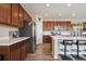 Updated kitchen with stainless steel appliances, center island and plenty of cabinet space at 27837 E 8Th Ave, Aurora, CO 80018