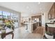 Open-concept kitchen features a large island, stainless steel appliances, and wood floors at 27837 E 8Th Ave, Aurora, CO 80018