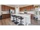 Stylish kitchen with a center island, stainless appliances, and seating for casual dining at 27837 E 8Th Ave, Aurora, CO 80018