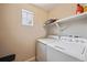 Image of a laundry room with washer and dryer, and storage space at 27837 E 8Th Ave, Aurora, CO 80018