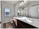 Modern bathroom with double vanity and a shower/tub combo at 12785 Horton Ct, Parker, CO 80134