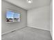 Simple bedroom with grey carpet and a window with a view at 12785 Horton Ct, Parker, CO 80134