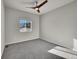 Spacious bedroom with ceiling fan and grey carpet at 12785 Horton Ct, Parker, CO 80134