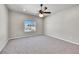 Well-lit bedroom with carpeted floor and ceiling fan at 12785 Horton Ct, Parker, CO 80134