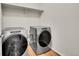 Laundry room with Whirlpool washer and dryer at 12785 Horton Ct, Parker, CO 80134