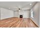 Spacious living room featuring hardwood floors and a fireplace at 12785 Horton Ct, Parker, CO 80134