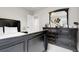 Bedroom featuring a black bedframe, matching dresser, and lots of wall decor at 6484 N Ceylon Ct, Denver, CO 80249