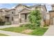 Charming two-story home with a two-car garage, inviting front porch and landscaped front yard at 6484 N Ceylon Ct, Denver, CO 80249