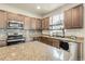 Well-equipped kitchen with stainless steel appliances and granite countertops at 6484 N Ceylon Ct, Denver, CO 80249