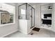 Bright main bathroom featuring a glass enclosed shower and views out of the window at 6484 N Ceylon Ct, Denver, CO 80249