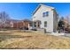 A spacious backyard featuring a pergola-covered patio with outdoor seating and built-in grill station at 9978 Salida St, Commerce City, CO 80022