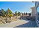 Outdoor deck and private backyard showcasing mature trees, and privacy fence at 5521 Longwood Cir, Highlands Ranch, CO 80130