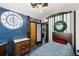 Bedroom features a unique design, blue tile accent wall, and an ornate clock decoration at 105 Dudley St, Lakewood, CO 80226