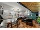 Basement living area includes modern lighting, a bar area, and comfortable seating at 105 Dudley St, Lakewood, CO 80226