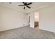 A spacious bedroom boasts a fan, neutral walls, and access to an ensuite bathroom at 12853 E 108Th Ave, Commerce City, CO 80022