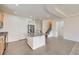 Modern kitchen with stainless steel appliances, granite countertops, and seamless flow into living area at 12853 E 108Th Ave, Commerce City, CO 80022
